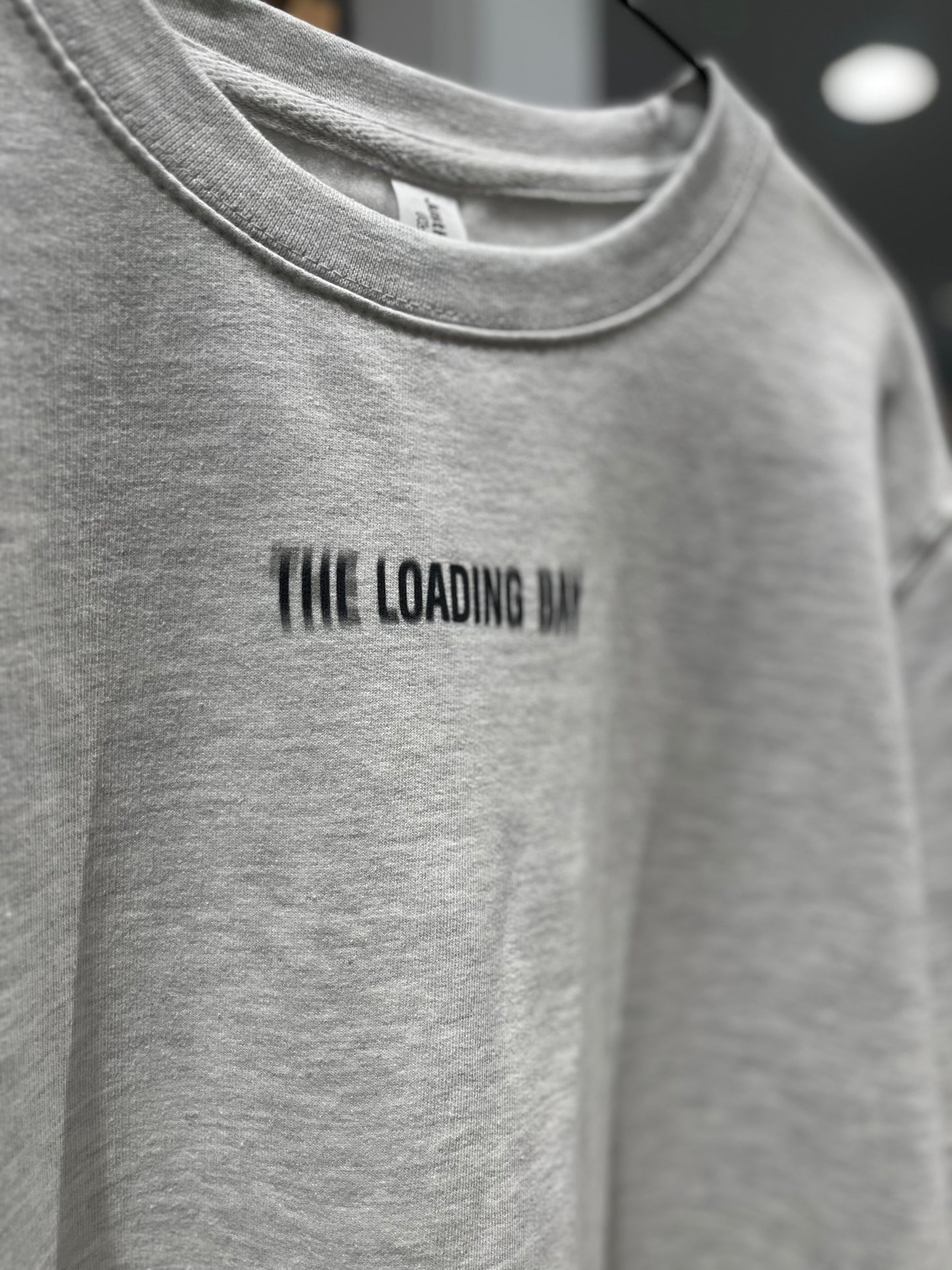1. TLB Grey Blurred Logo Sweater